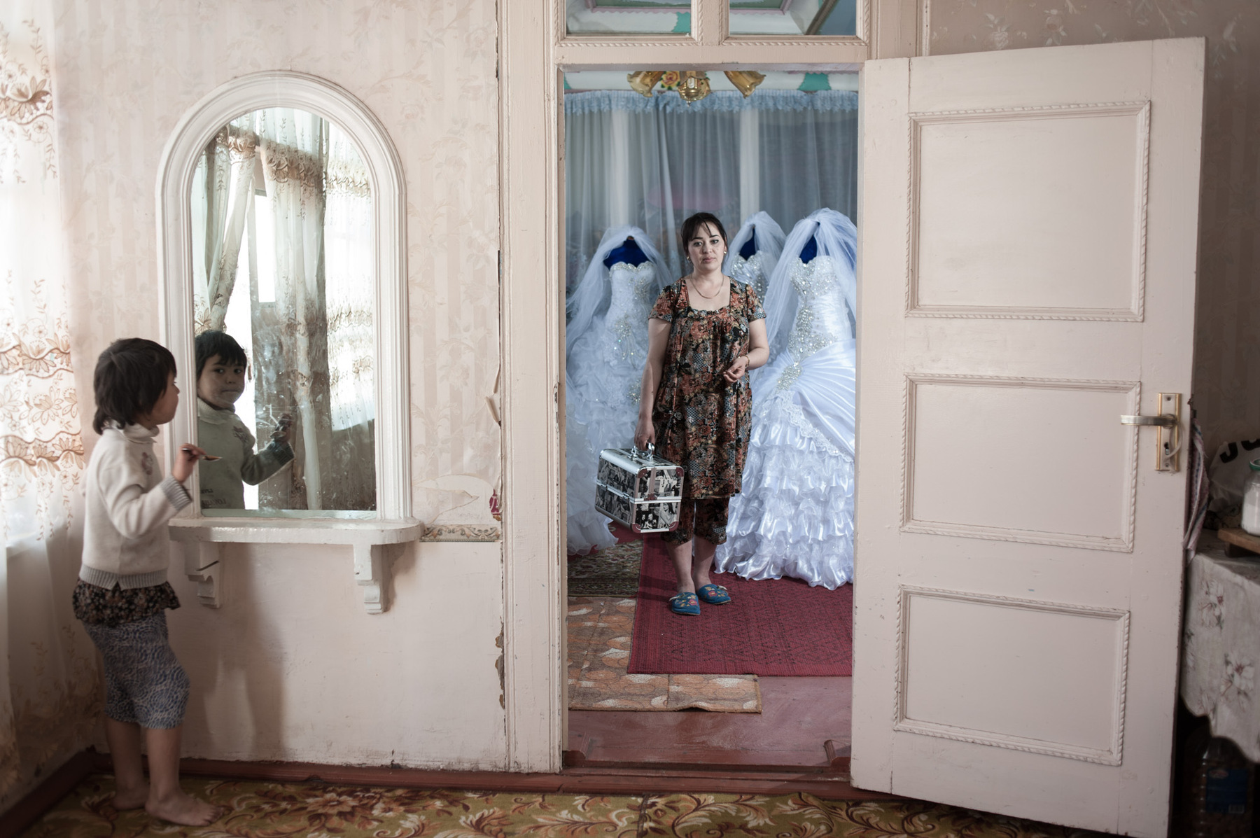 Konstantin Salomatin - 27 Wedding dress designer and hairdresser Gulnara Unusova at her home studio. Tajikistan, Asht District, Oshoba village.